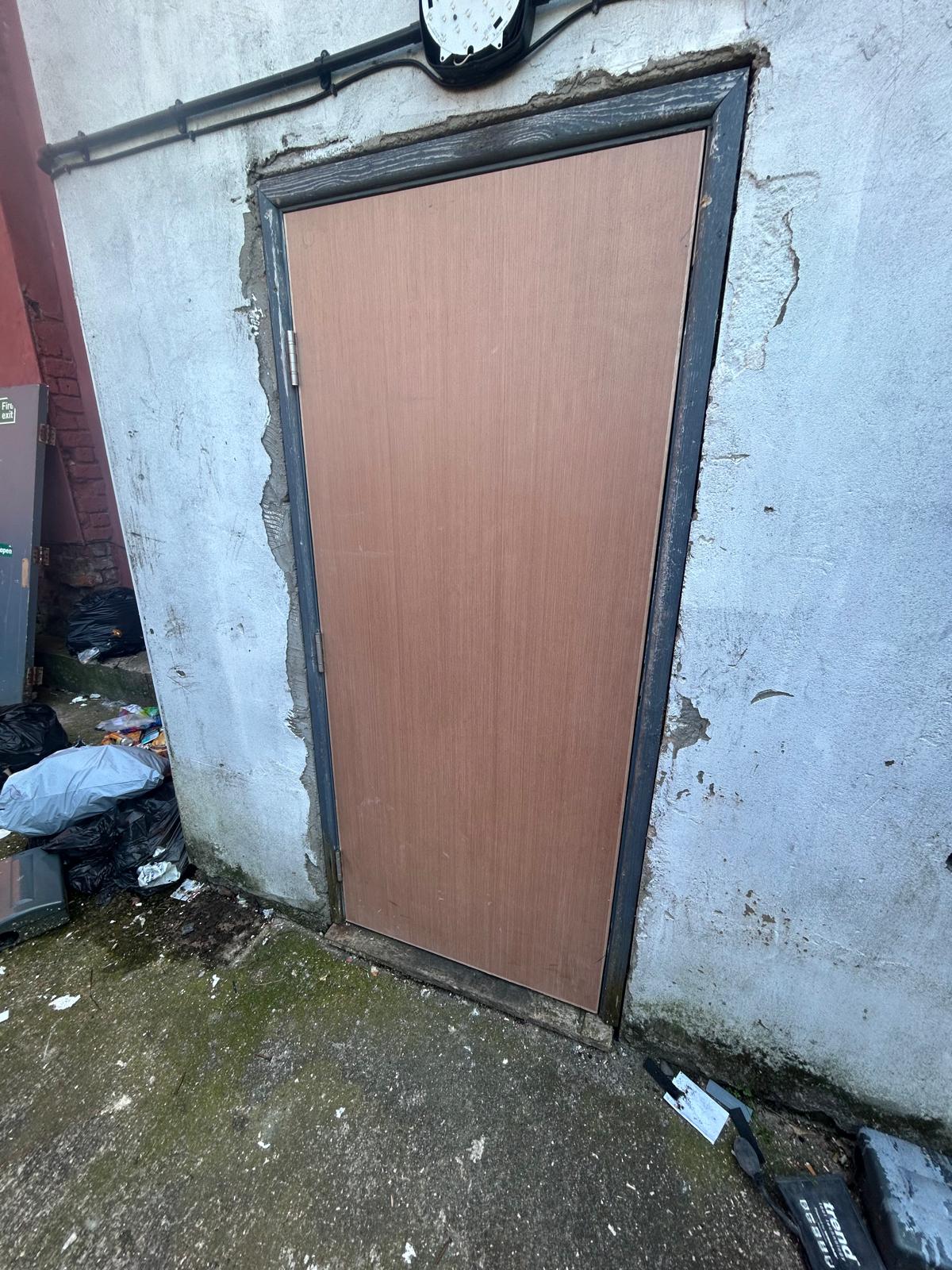 Compliant fire door fitted in apartment communal area by D2 Joinery Merseyside