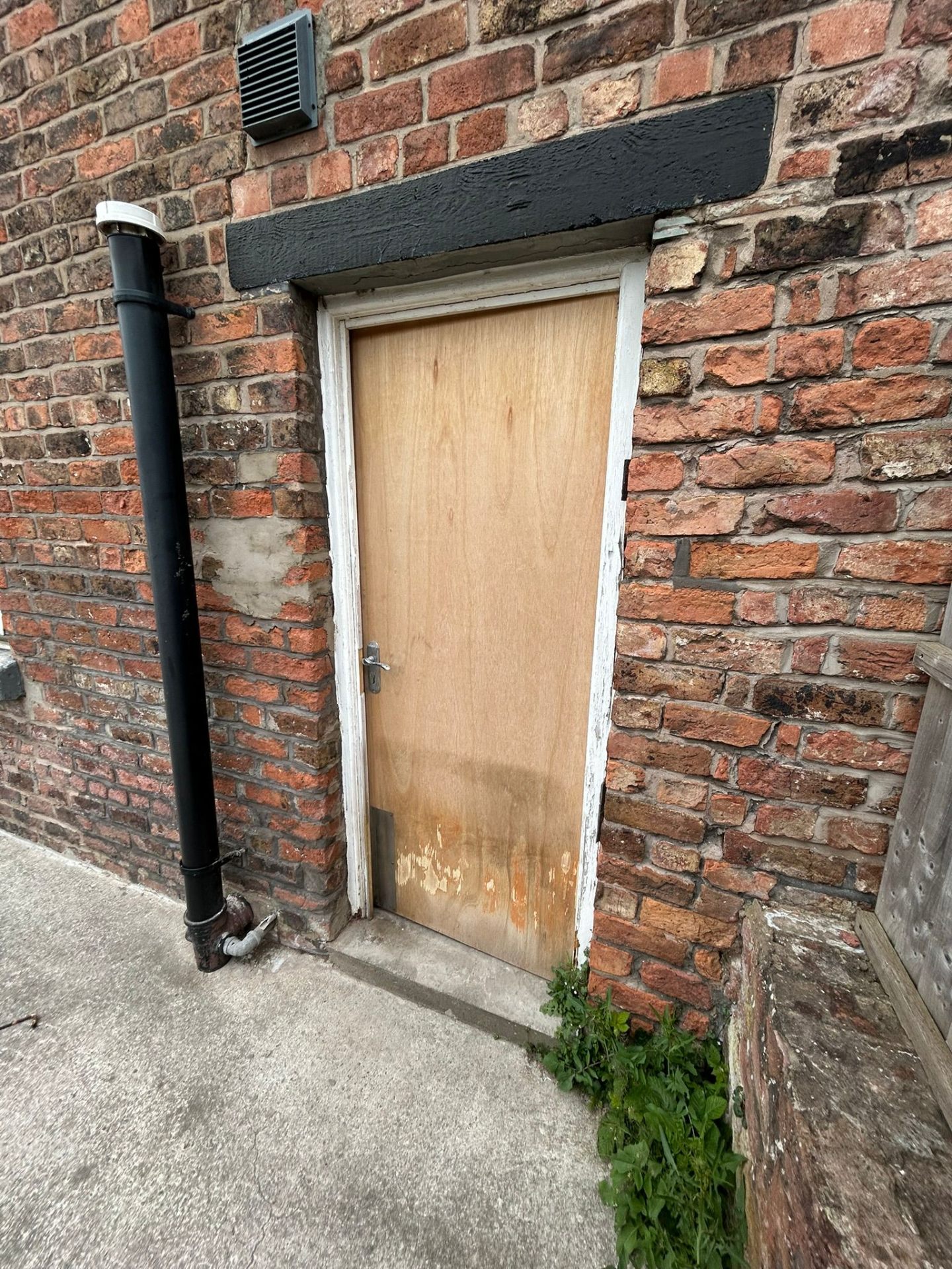 Non-compliant door before replacement with certified fire door in HMO