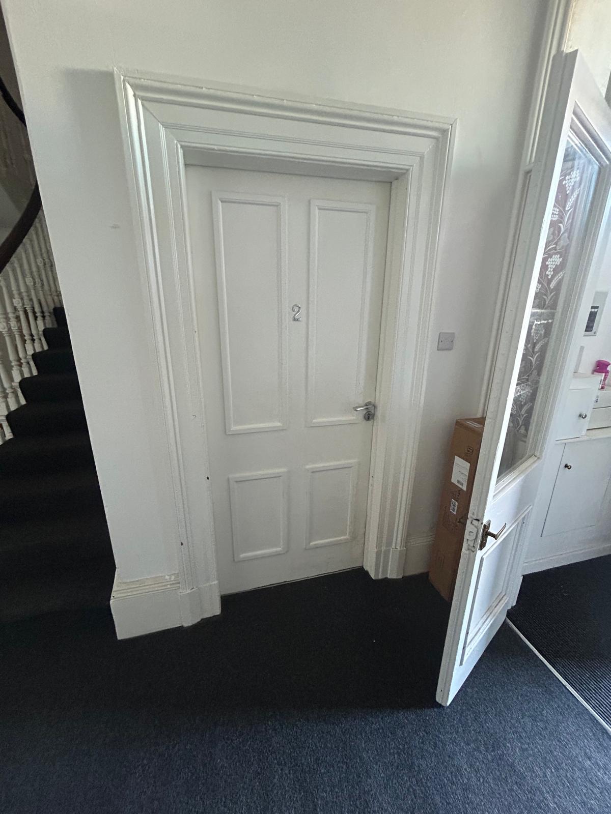 Standard internal door before fire door upgrade in a Merseyside property